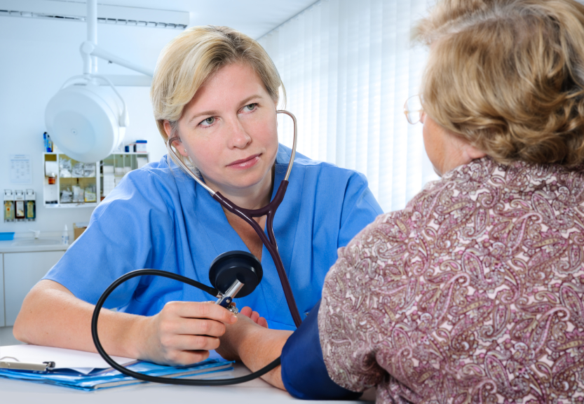 health professional measuring blood pressure
